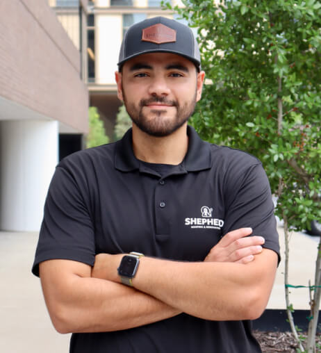 Shepherd Commercial Roofing team member standing confidently outdoors, representing professional and approachable customer service in Texas.