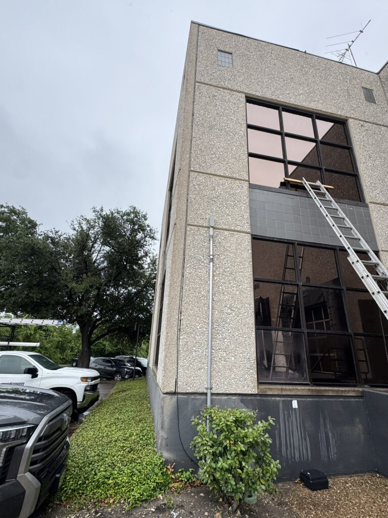 building and ladder on window