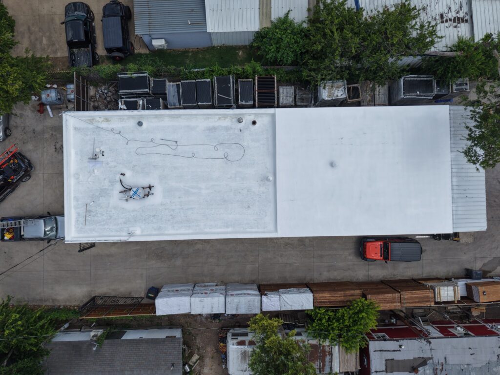 Shepherd Commercial Roofing applying reinforced roofing system